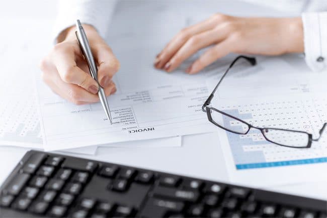 Professional reviewing an accounts receivable invoice